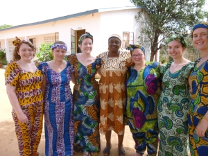 The team dressed in our new Gambian outfits with Auntie Caddy